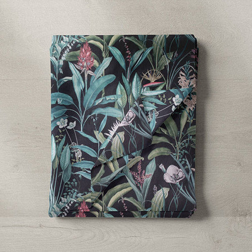 Black fabric by the metre – folded floral patterned fabric in black with green and pink detailing