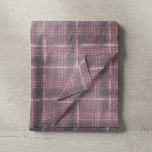 Purple and wine toned fabrics in plum, aubergine and berry shades for curtains and upholstery.