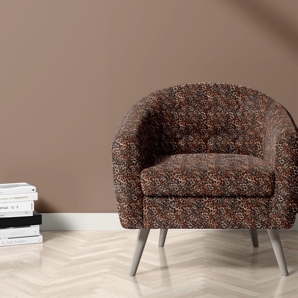 African leopard print fabric on chair in a decorative room setting