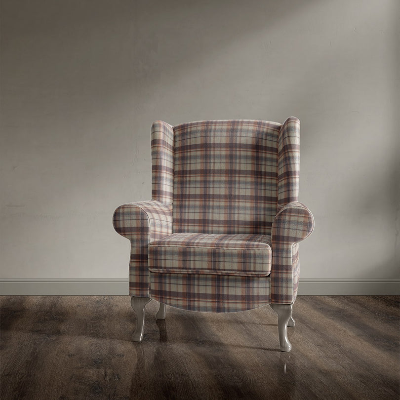 Accent chair covered in Alder Plaid Clementine checked upholstery fabric