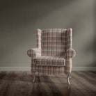 Upholstered armchair in Alder Plaid Orange checked fabric