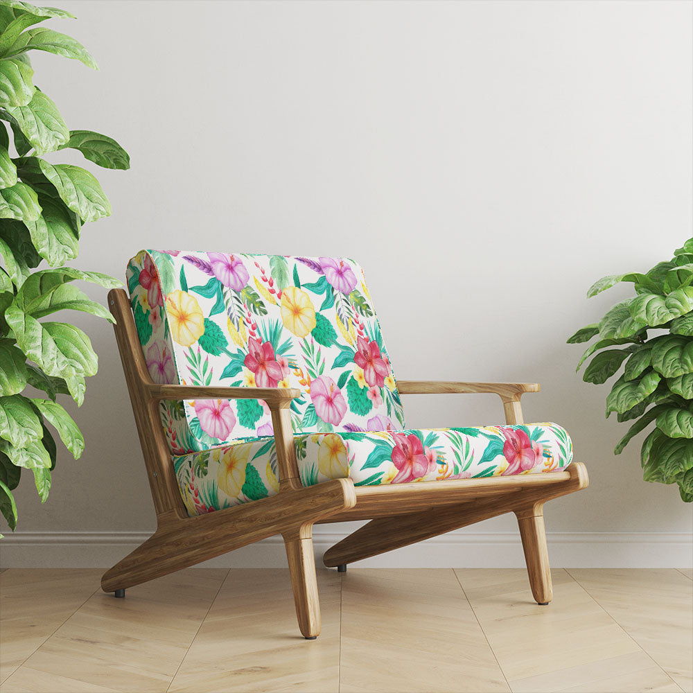 Amaranta Crib 5 floral velvet upholstery fabric shown on a chair with green tropical foliage