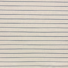 Anfo Navy striped curtain fabric with deep blue stripes on a neutral base, creating a striking contrast for bold interiors.