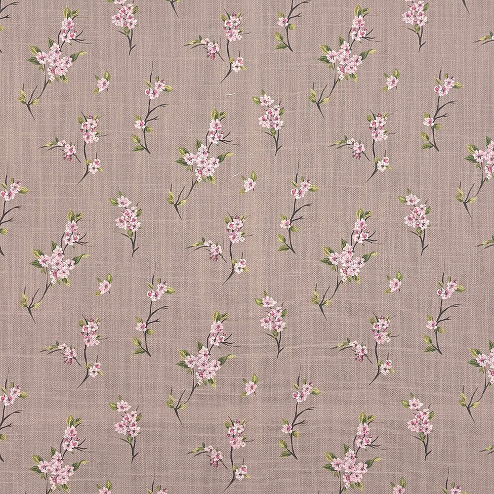 Close-up of Apple Blossom linen curtain fabric in Natural with pink floral design on a soft taupe background