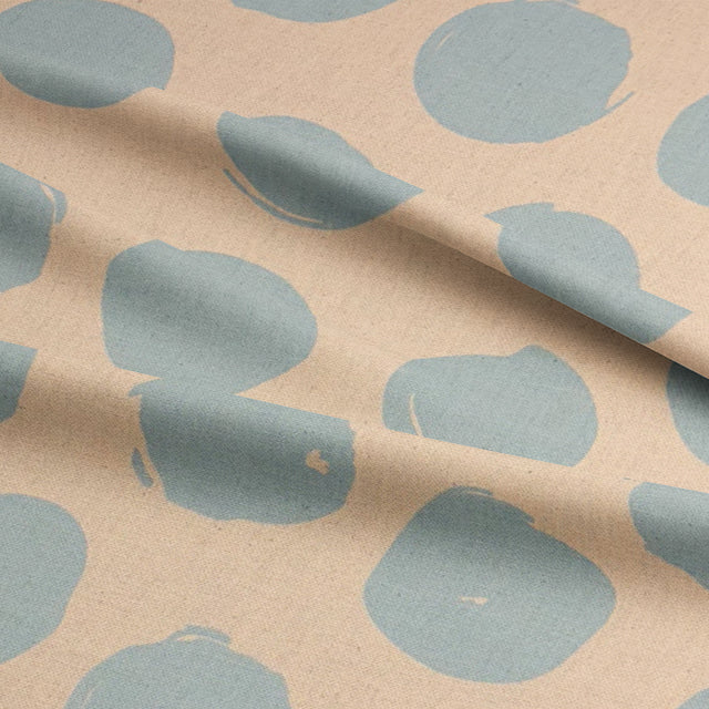 Spotted polka dot curtain fabric in baby blue from the Arno collection, perfect for modern interiors.