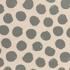 Arno Spot Fennel curtain fabric, featuring a fresh green polka dot print for natural décor.