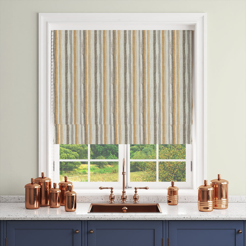 Ochre and grey striped curtain fabric styled as a Roman blind