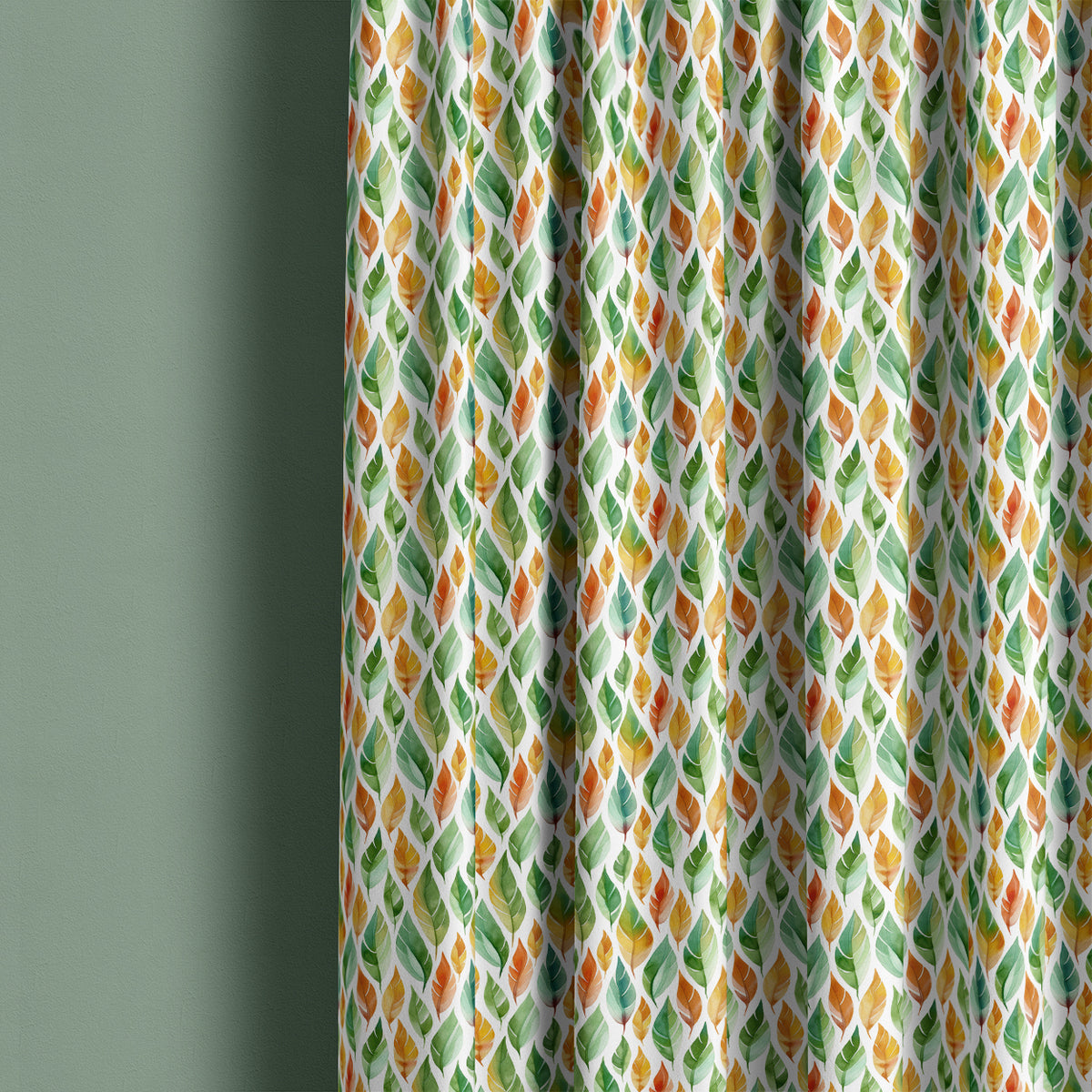 Avon multicoloured leaf curtain fabric shown as full-length curtains in a green interior