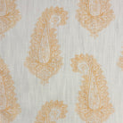 Baku Paisley Linen curtain fabric with intricate ochre yellow paisley pattern on a natural linen background.