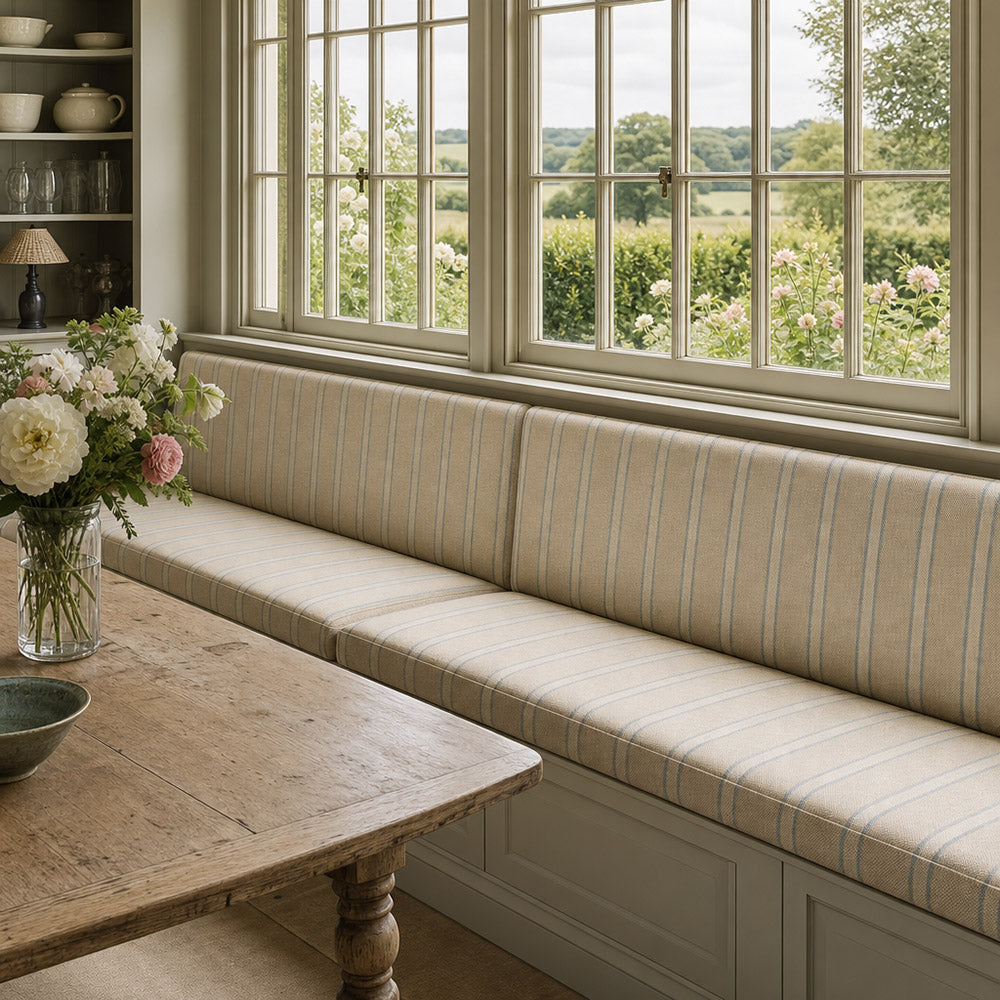 Braemar Sky striped upholstery fabric on bench, light blue stripe fabric for upholstered seating and relaxed window treatments