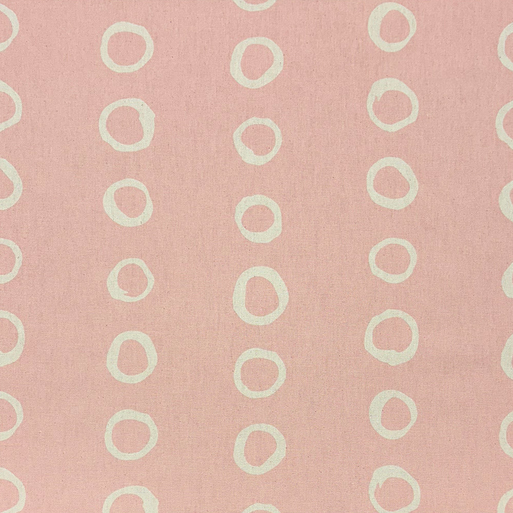 Calaggio Blush Spotty Polka Dot Curtain Fabric - Flat Sample showcasing a soft pink background with delicate off-white circular motifs.
