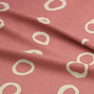 Calaggio Coral Spotty Curtain Fabric - Draped Fabric Detail emphasizing the fabric’s smooth texture and flowing drape.