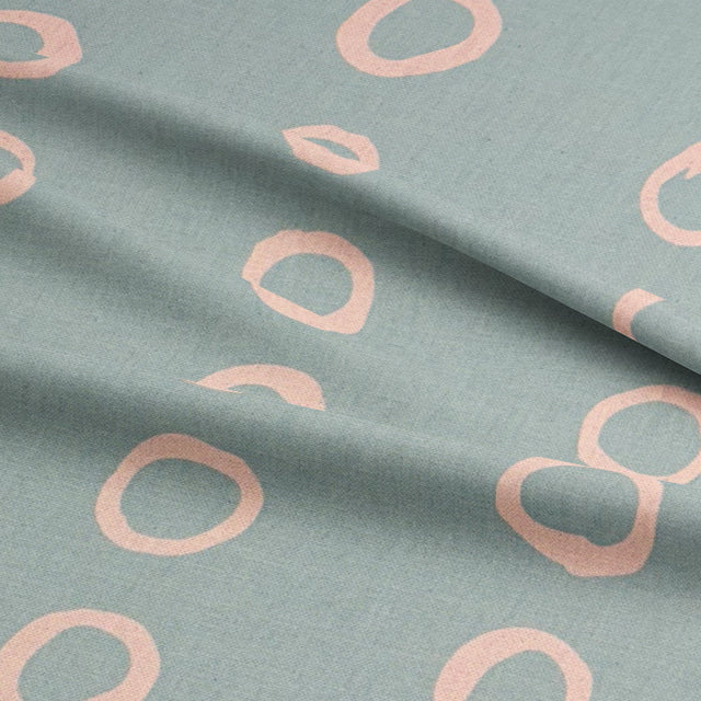 Calaggio Duck Egg Spotty Polka Dot Fabric - Draped View showing the gentle folds and lightweight texture.
