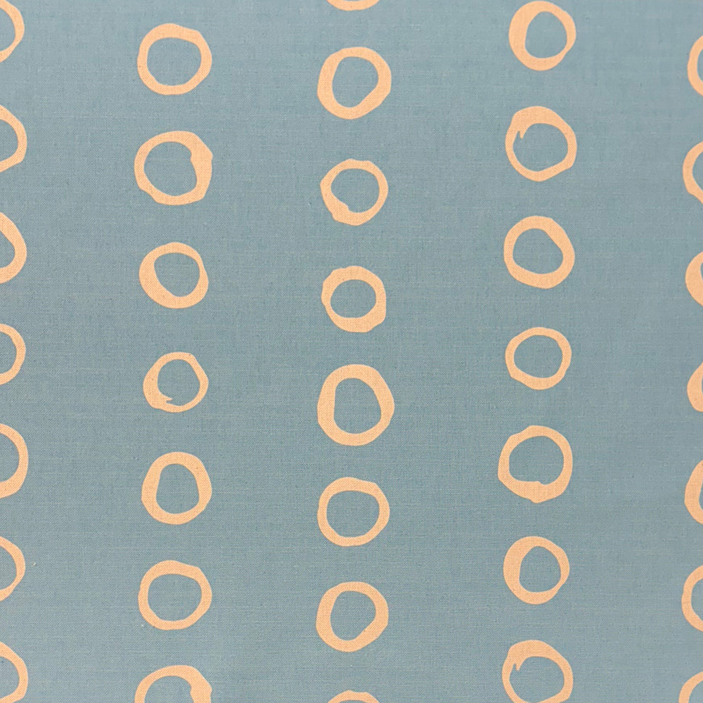 Calaggio Sky Polka Dot Curtain Fabric - Flat Sample in a soft blue hue with subtle, painterly polka dots.
