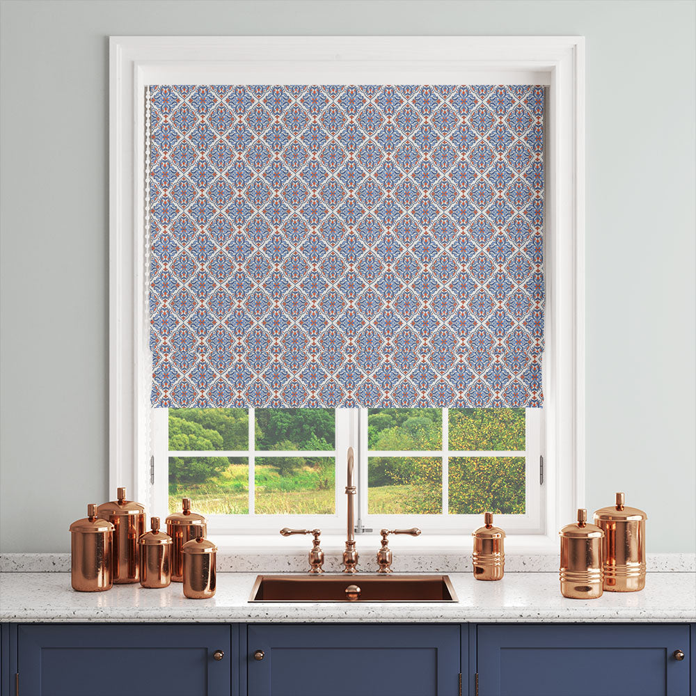 curtain fabric with blue mediterranean pattern used as roman blind in kitchen setting