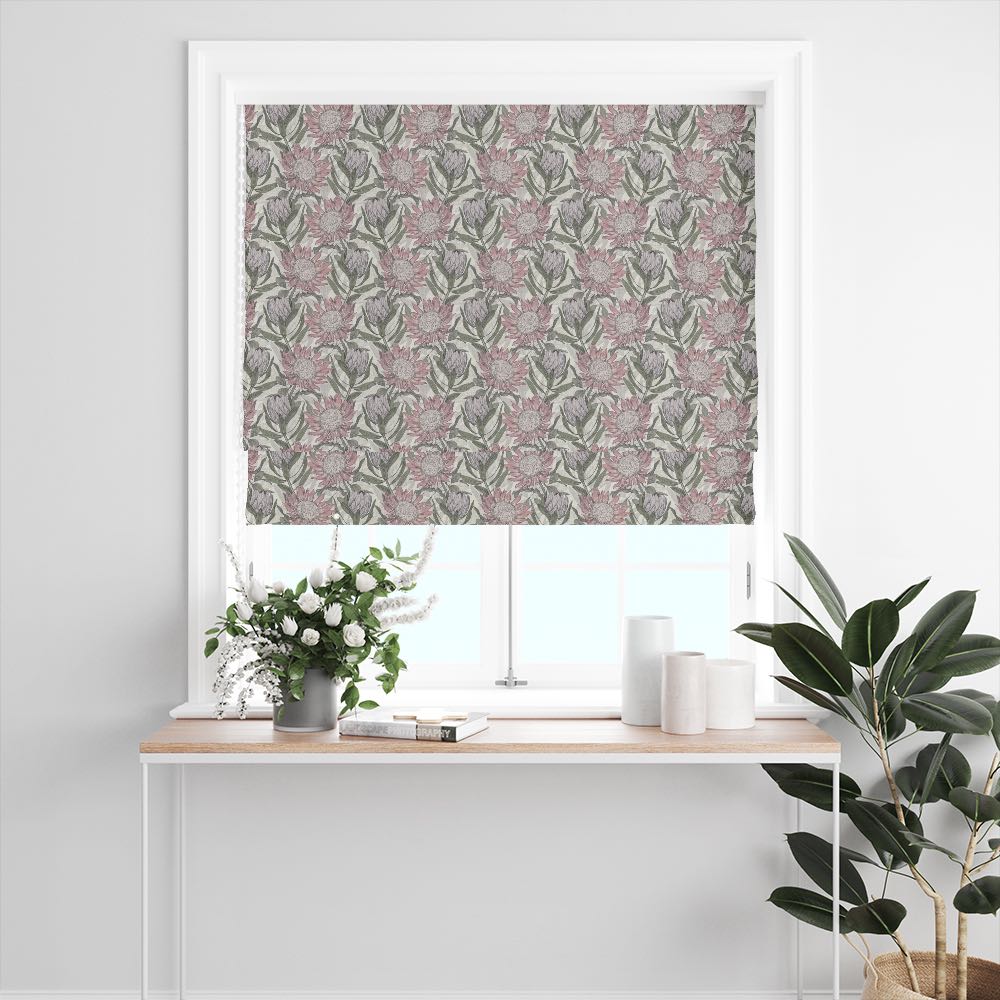 Calstock Ivory floral linen curtain fabric used for a Roman blind featuring soft botanical flowers on a white background in a bright window setting