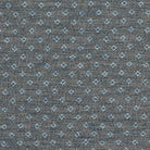 Chambray blue fire-retardant upholstery fabric with a structured dobby weave.