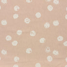 Chiese natural polka dot curtain fabric with a soft, neutral spotted pattern for versatile styling.