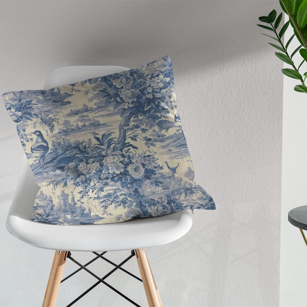 Colmar blue French toile fabric styled as a decorative cushion in a classic interior