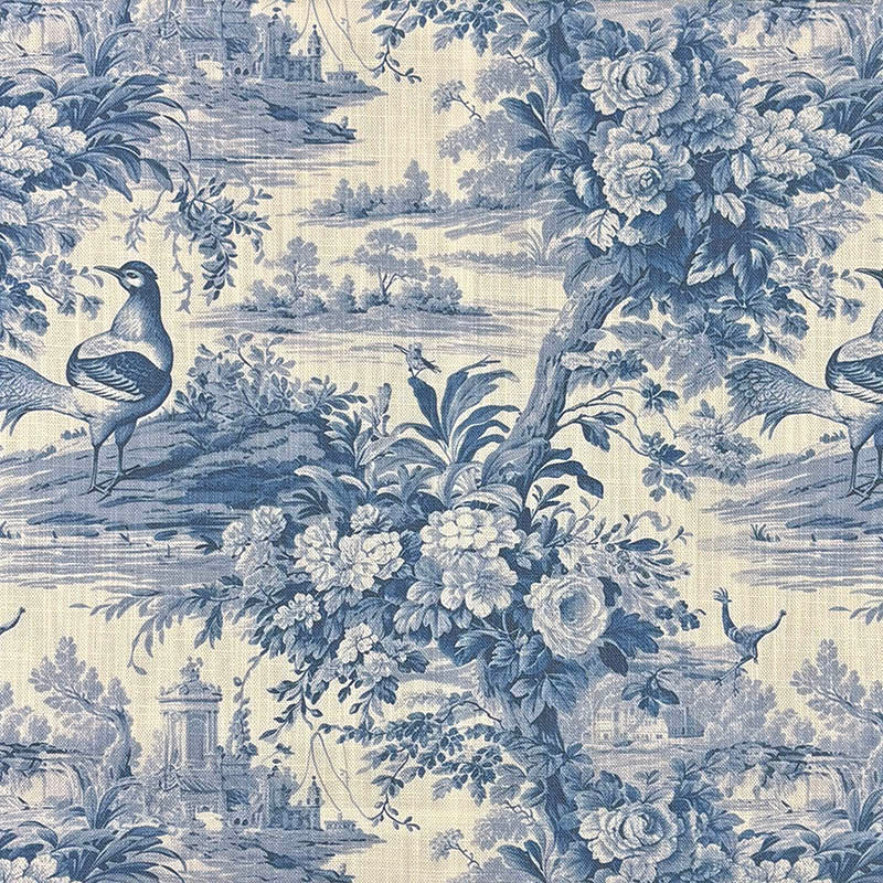 Blue toile linen curtain fabric with birds, flowers and a country landscape in a flat view