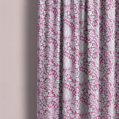 A close-up image of a vibrant Cynara Flower Fabric, showcasing its intricate floral patterns and rich, textured material