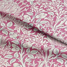 Beautiful Cynara Flower Fabric, featuring vibrant purple and pink blooms on a high-quality, textured fabric perfect for upholstery and home décor projects
