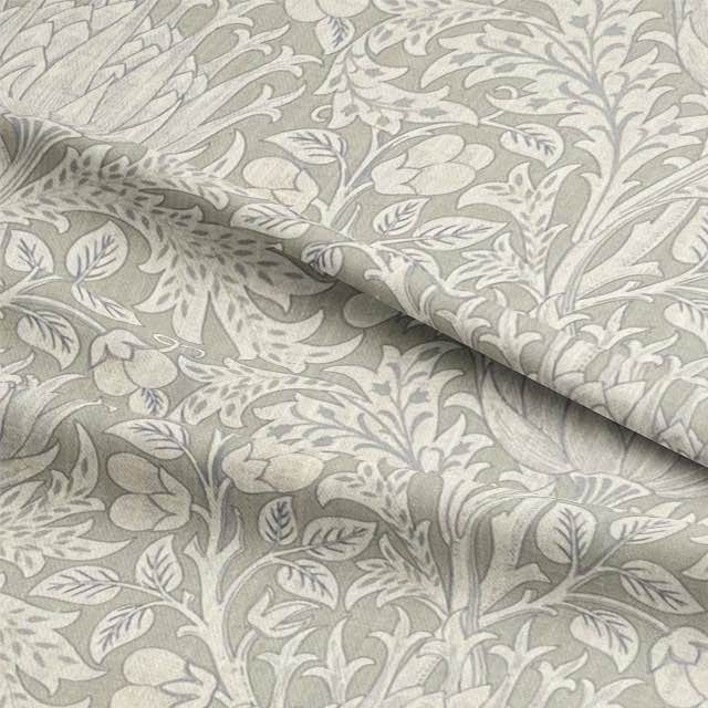 Close up image of Cynara Flower Fabric, a beautiful floral patterned textile perfect for home decor and fashion projects