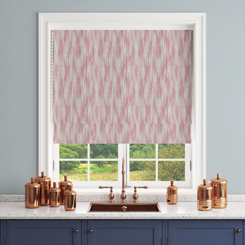 Roman blind made from Dallas Pink striped curtain fabric in a kitchen setting, featuring warm pink broken stripes.