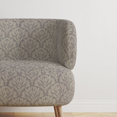 Chair upholstered in Driftwood Leaf Dove Grey fabric, perfect for interiors.