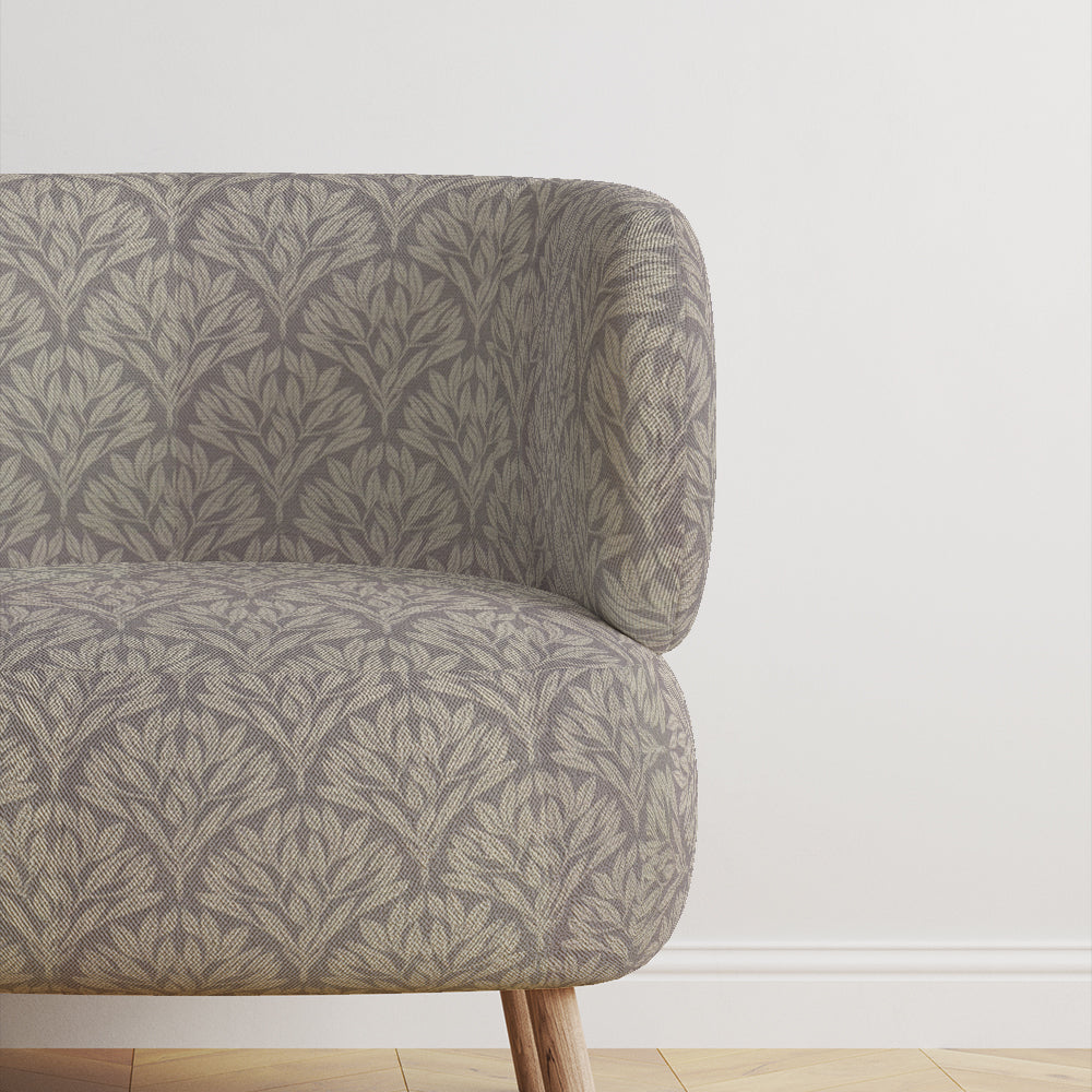 Chair upholstered in Driftwood Leaf Dove Grey fabric, perfect for interiors.