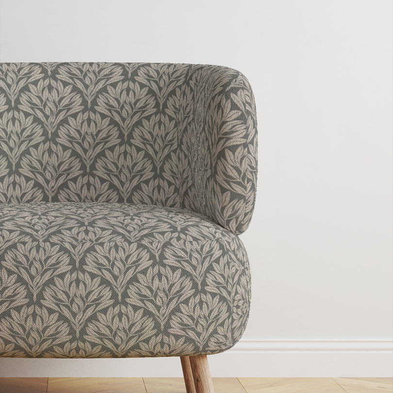 Chair covered in Driftwood Leaf Fennel fabric, ideal for upholstery use.