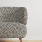 Chair covered in Driftwood Leaf Fennel fabric, ideal for upholstery use.