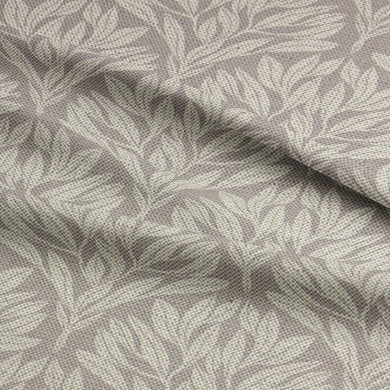 Folded Driftwood Leaf Natural fabric, highlighting its intricate leaf pattern.
