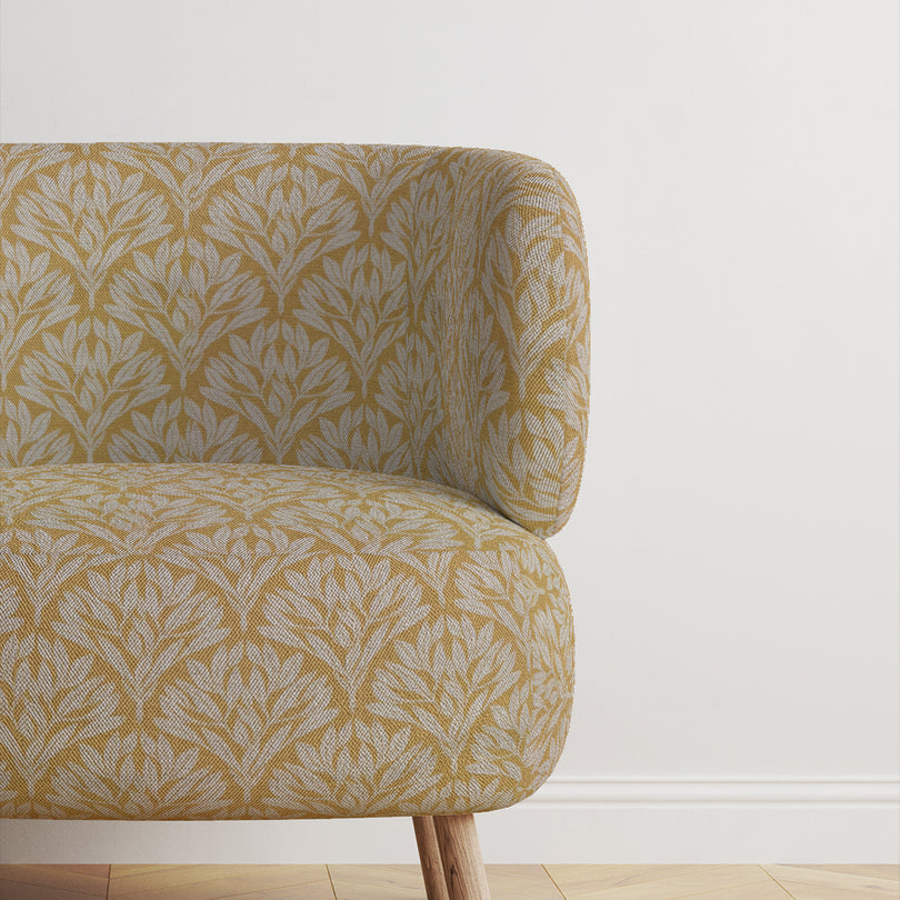 Chair featuring Driftwood Leaf Ochre fabric, ideal for stylish upholstery.