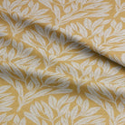 Soft folds of Driftwood Leaf Ochre fabric, showcasing its durable texture.