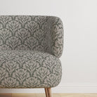 Chair upholstered in Driftwood Leaf Sage fabric, a refined upholstery choice.