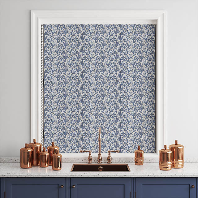 Beautifully draped Duloe Cotton Curtain Fabric in Blue, creating a chic and sophisticated window treatment