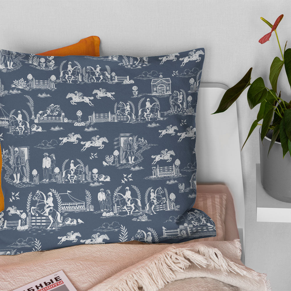 Blue horse print curtain fabric shown on a decorative cushion in a traditional country interior