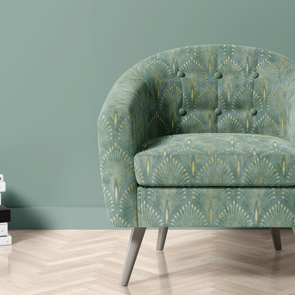 Feathercrest Green fire retardant velvet upholstery fabric shown on a chair with fan motif