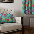 Folk Flowers Teal curtain fabric on armchair with matching cushion
