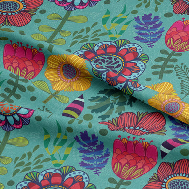 Beautiful teal fabric featuring intricate folk flower patterns
