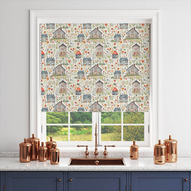 Folk House Green fabric as a Roman blind in a white-framed kitchen window