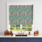 Folk house teal fabric used in a roman blind – colourful countryside scene with floral detailing.
