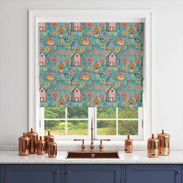 Folk house teal fabric used in a roman blind – colourful countryside scene with floral detailing.