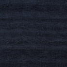 Fontwell Indigo fire-retardant upholstery fabric with a classic woven texture.