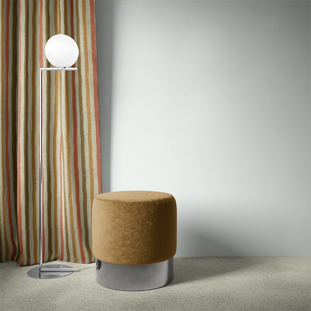 Fremont Golden striped curtain fabric styled as curtains in a soft neutral and ochre palette.