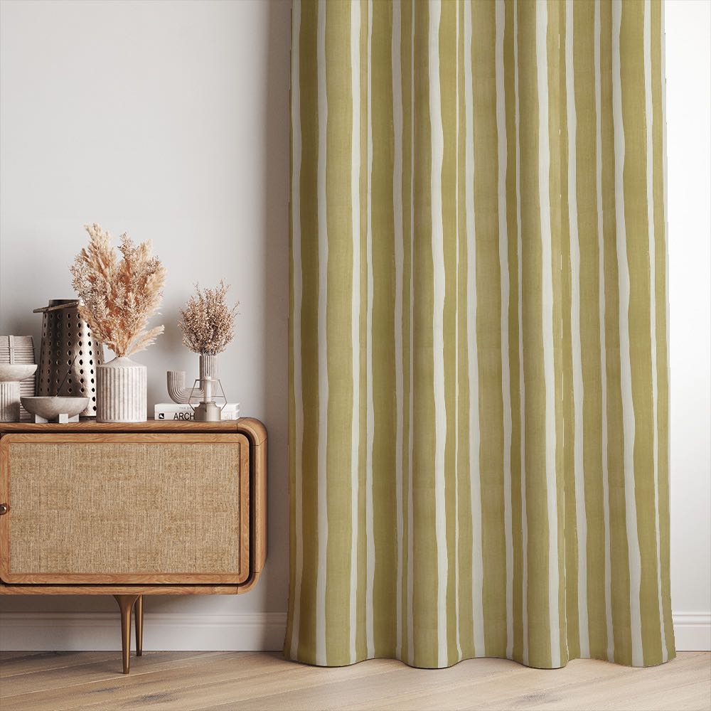 Fresno Stripe Golden linen curtain fabric styled as curtains featuring warm ochre yellow stripes in a natural-toned room