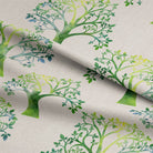 Eco-friendly and sustainable linen curtain fabric in beautiful green color with intricate tree design