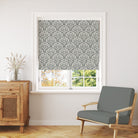 Harewood Leaf Linen curtain fabric in fennel green, styled as a window blind for a natural and timeless interior.