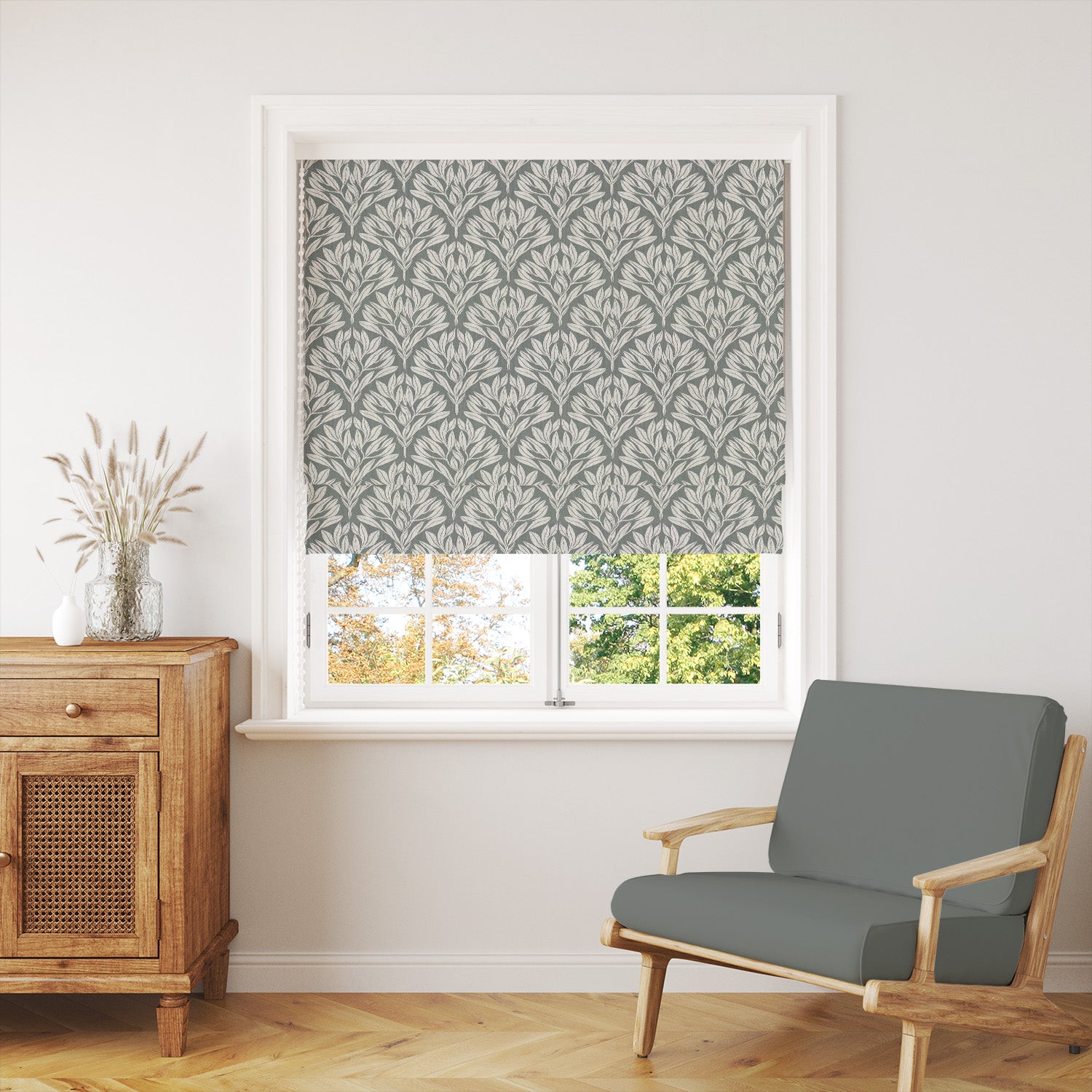 Harewood Leaf Linen curtain fabric in fennel green, styled as a window blind for a natural and timeless interior.